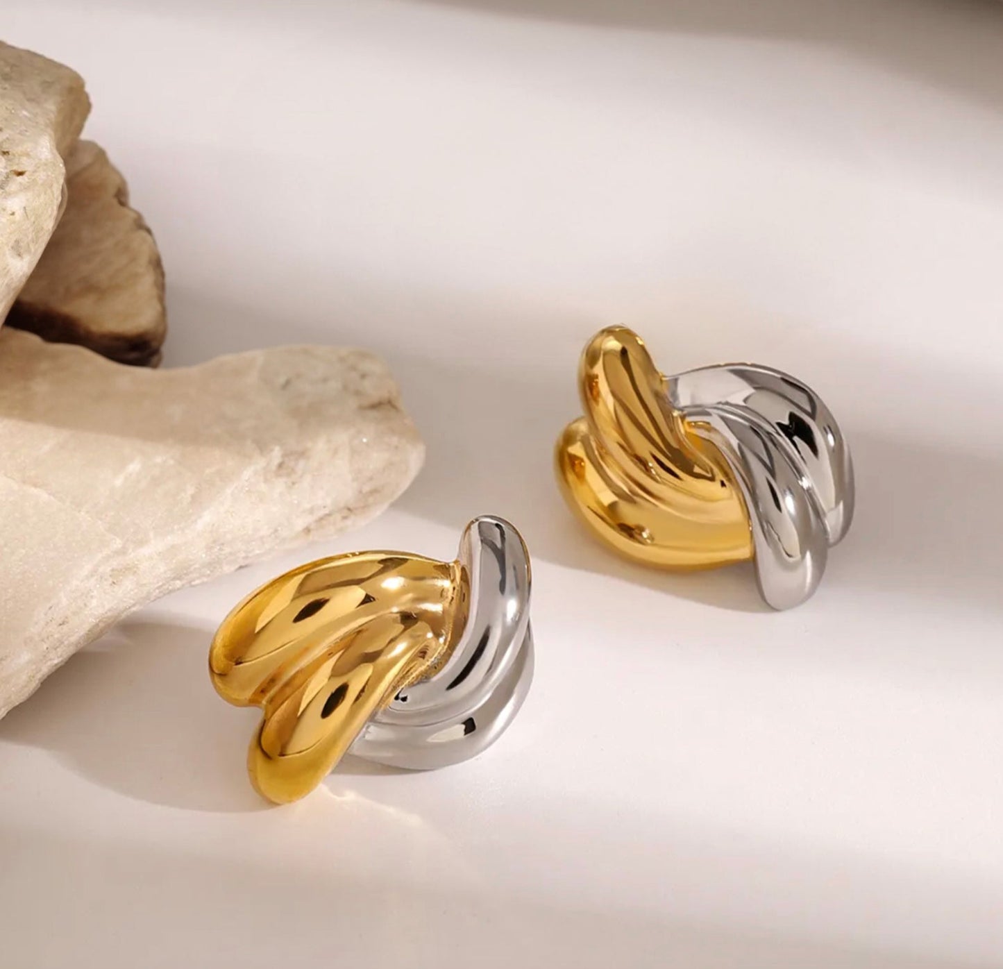 gold earrings for women, gold stud earrings, gold statement earrings, mixed metal earrings, silver earrings for women on model